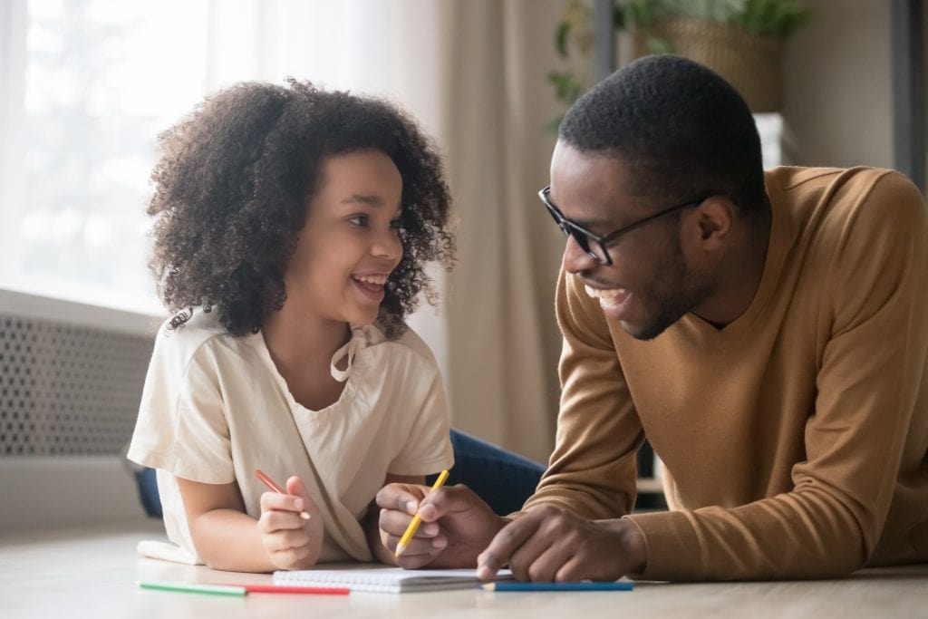 dad and daughter doing homework