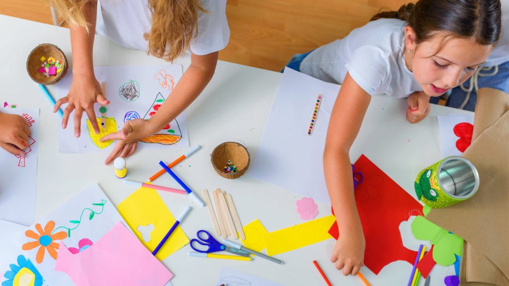 Children at a table doing crafts