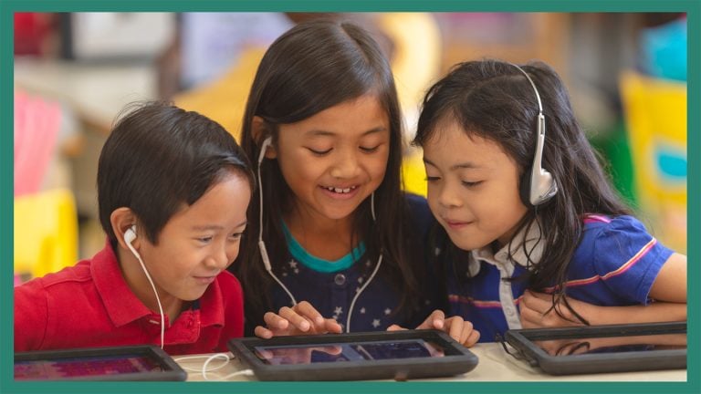 3 children doing a tablet activity