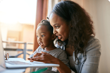 Caregiver with child doing homework