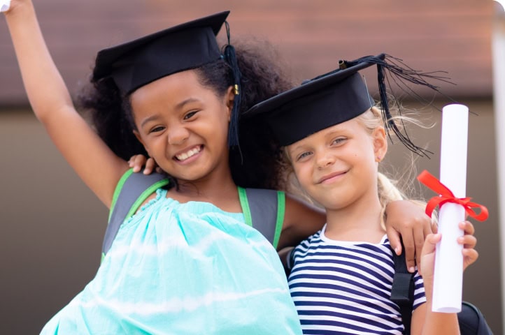 two girls graduating